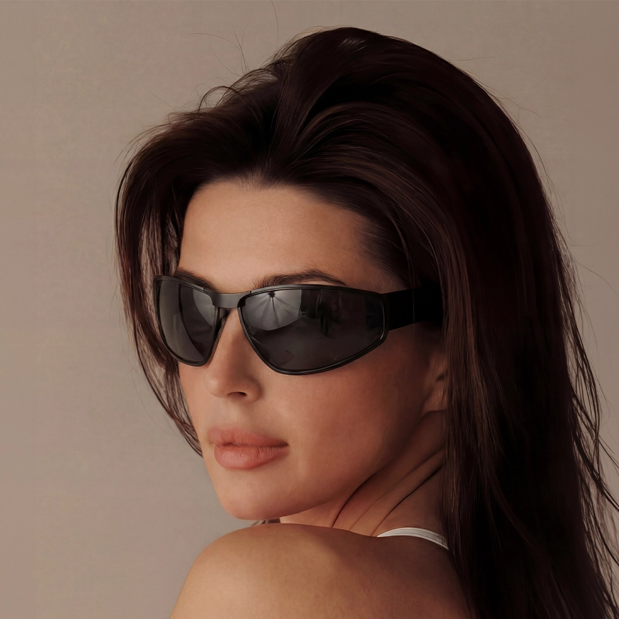 Woman wearing dark theflyshades sunglasses with a neutral background